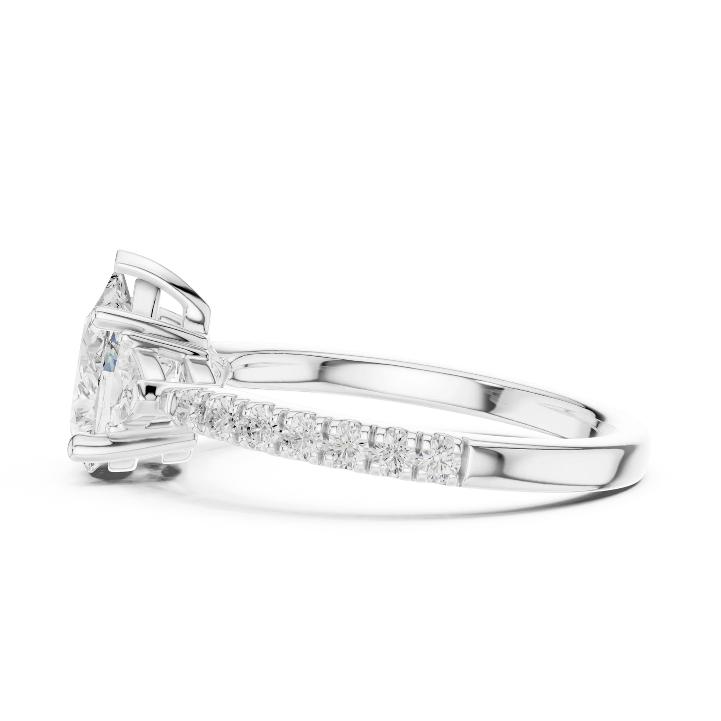 Side view of white gold pear three stone diamond ring with half moon side stones and pave band, highlighting setting profile.