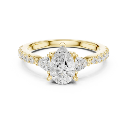 Lab-grown pear cut three stone diamond ring with half moon side stones and pave band in yellow gold, top view.