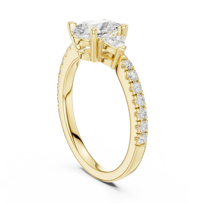 Back view of yellow gold pear three stone diamond ring with half moon side stones and pave band, showing band structure.