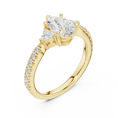 Front view of yellow gold pear three stone diamond ring with half moon side stones and pave band, emphasizing brilliance.
