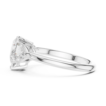 Side view of white gold pear three-stone ring with trillion cut side stones and lab-grown diamond 鈥?Australia