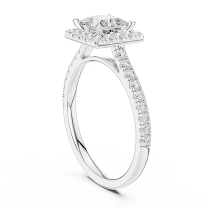 Top view of white gold princess-cut halo ring with pav茅 diamond band and lab-grown center stone