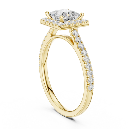 Top view of yellow gold princess-cut halo ring with pav茅 diamond band and lab-grown center stone