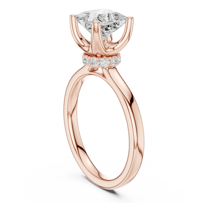 Back view of rose gold princess cut solitaire ring showing hidden halo and domed band structure