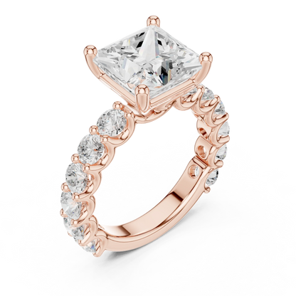 Front view of rose gold princess cut solitaire ring with shared prong large stone band and center stone