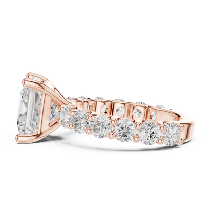 Side profile of rose gold princess cut solitaire ring with shared prong large stone band and elevated center stone