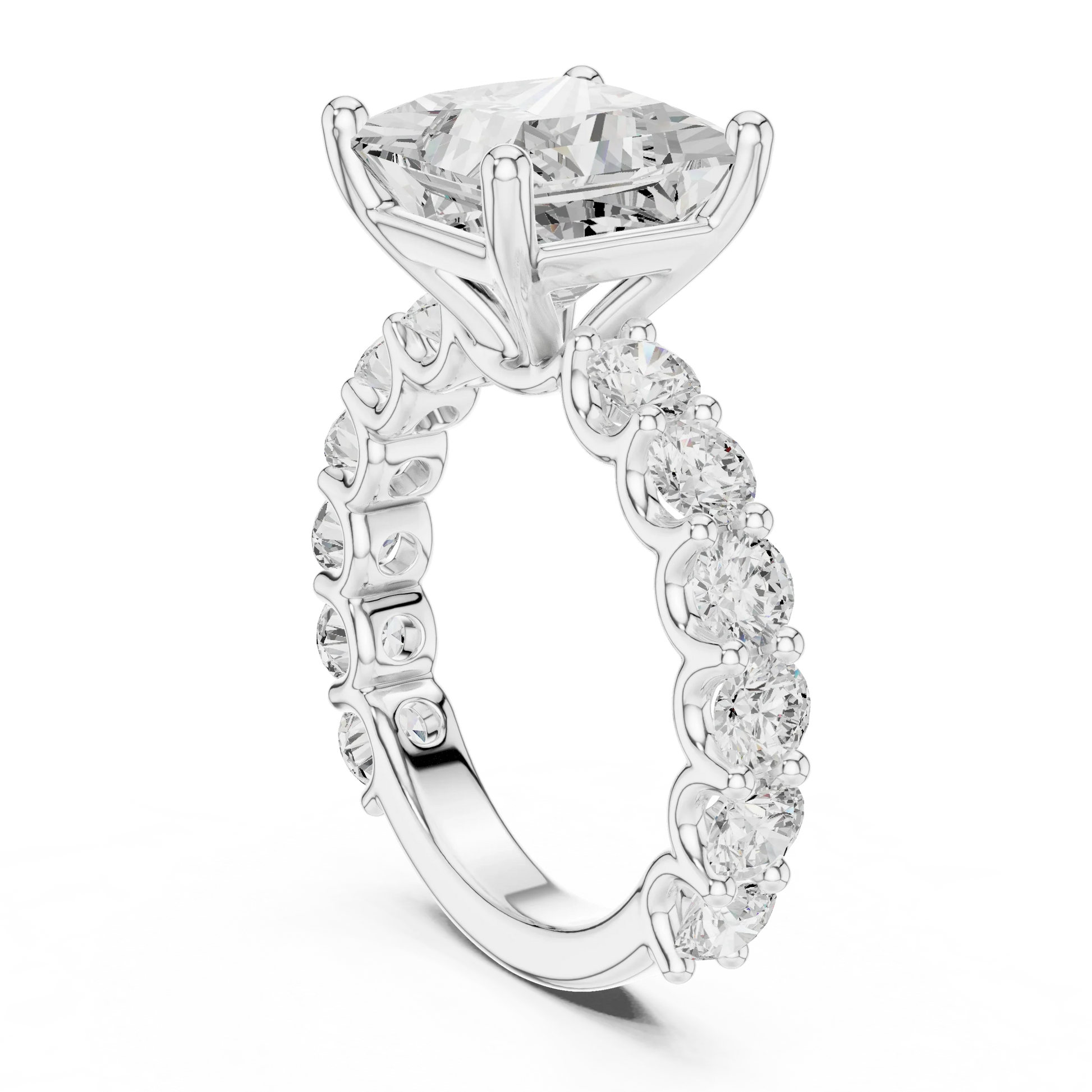 Back side view of white gold princess cut solitaire ring showing shared prong large stone band and setting details