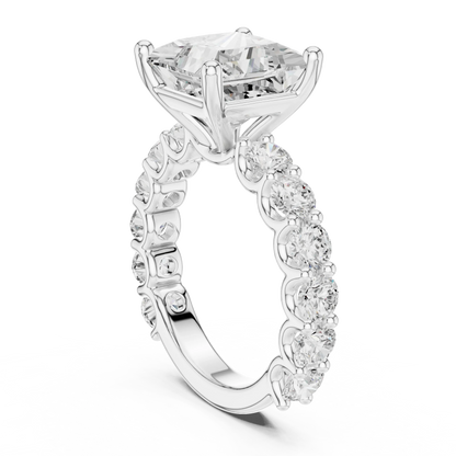 Back side view of white gold princess cut solitaire ring showing shared prong large stone band and setting details