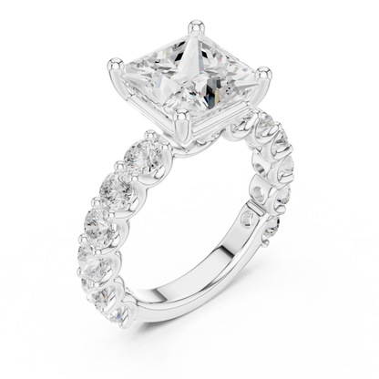 Front view of white gold princess cut solitaire ring with shared prong large stone band and center stone