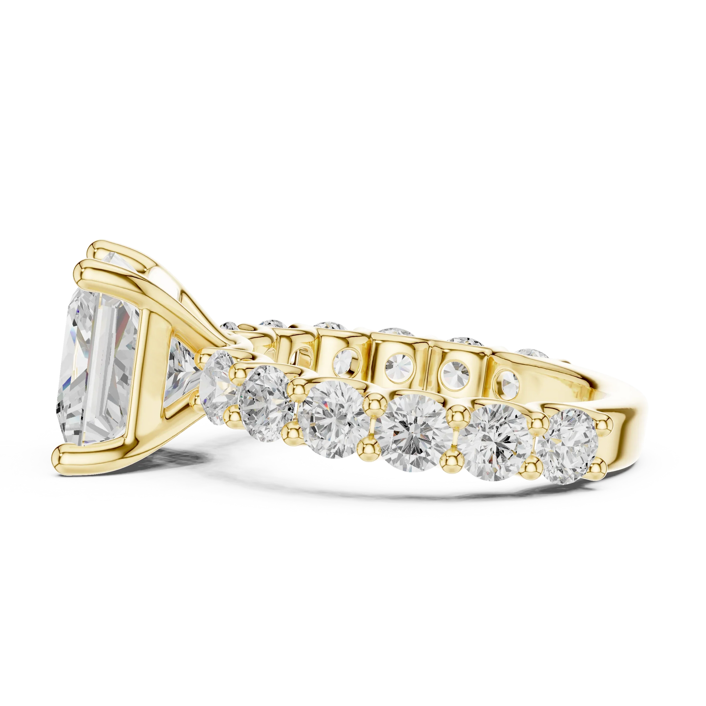 Side view of yellow gold princess cut solitaire ring with shared prong large stone band and prong setting
