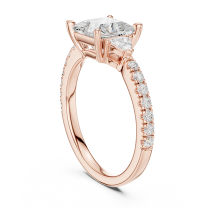 Back view of rose gold princess three stone diamond ring with half moon side stones and pave band, detailing band and setting.