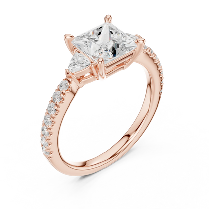 Front view of rose gold princess three stone diamond ring with half moon side stones and pave band, showcasing gemstone brilliance.