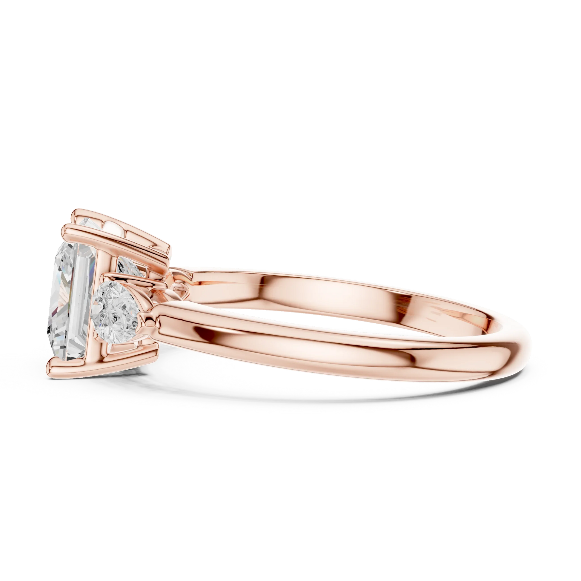 Side view of rose gold princess three-stone ring with pear side stones and lab-grown diamond 鈥?Australia