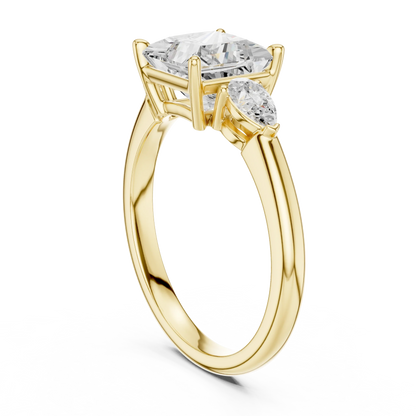 Back side view of yellow gold princess three-stone ring with pear side stones and lab-grown diamond 鈥?Australia