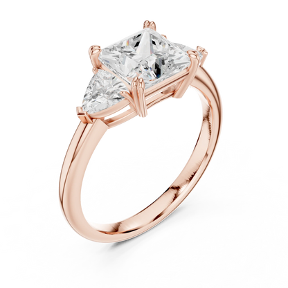 Front view of rose gold princess three-stone ring with trillion cut side stones and lab-grown diamond 鈥?Australia