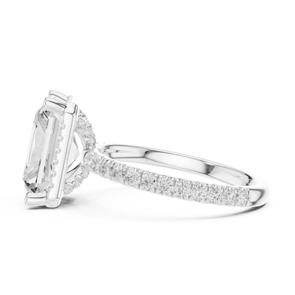 Side view of white gold radiant cut micro halo ring highlighting pav茅 diamond band and halo profile