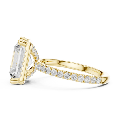 Side view of yellow gold radiant cut micro halo ring highlighting pav茅 diamond band and halo profile