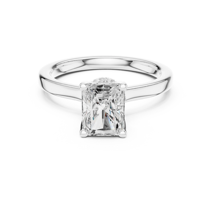 White gold radiant cut solitaire ring with hidden halo and domed band featuring lab-grown diamond, elegant design