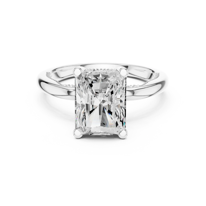 White gold radiant cut solitaire ring with hidden halo and domed band featuring lab-grown diamond, elegant design