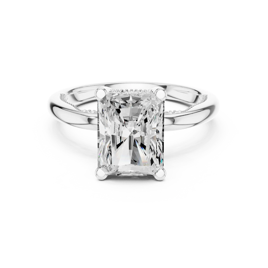White gold radiant cut solitaire ring with hidden halo and domed band featuring lab-grown diamond, elegant design