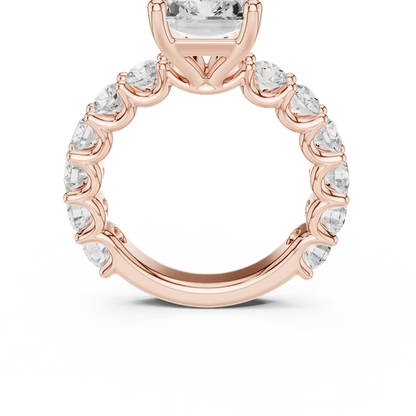 Front view of rose gold radiant cut solitaire ring with shared prong large stone band and center stone