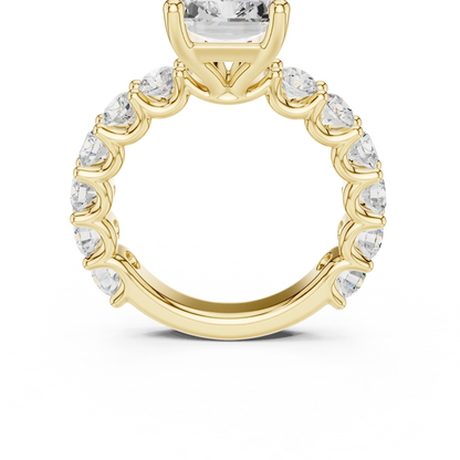 Front view of yellow gold radiant cut solitaire ring with shared prong large stone band and center gemstone