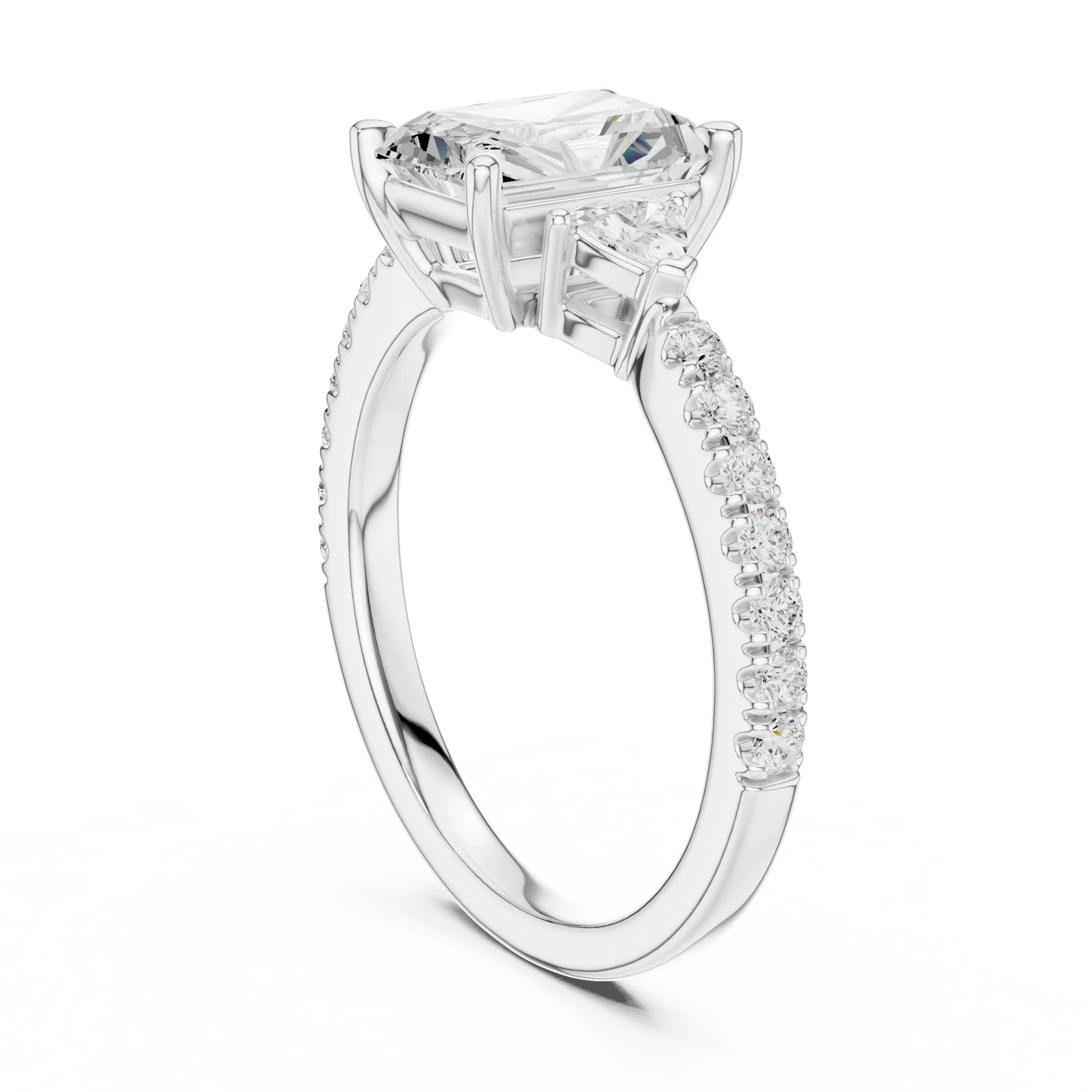 Back view of white gold radiant three stone diamond ring with half moon side stones and pave band, showing band and setting.