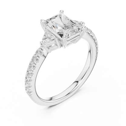 Front view of white gold radiant three stone diamond ring with half moon side stones and pave band, showcasing center stone.