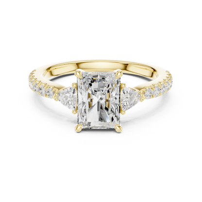 Lab-grown radiant cut three stone diamond ring with half moon side stones and pave band in yellow gold, top view.
