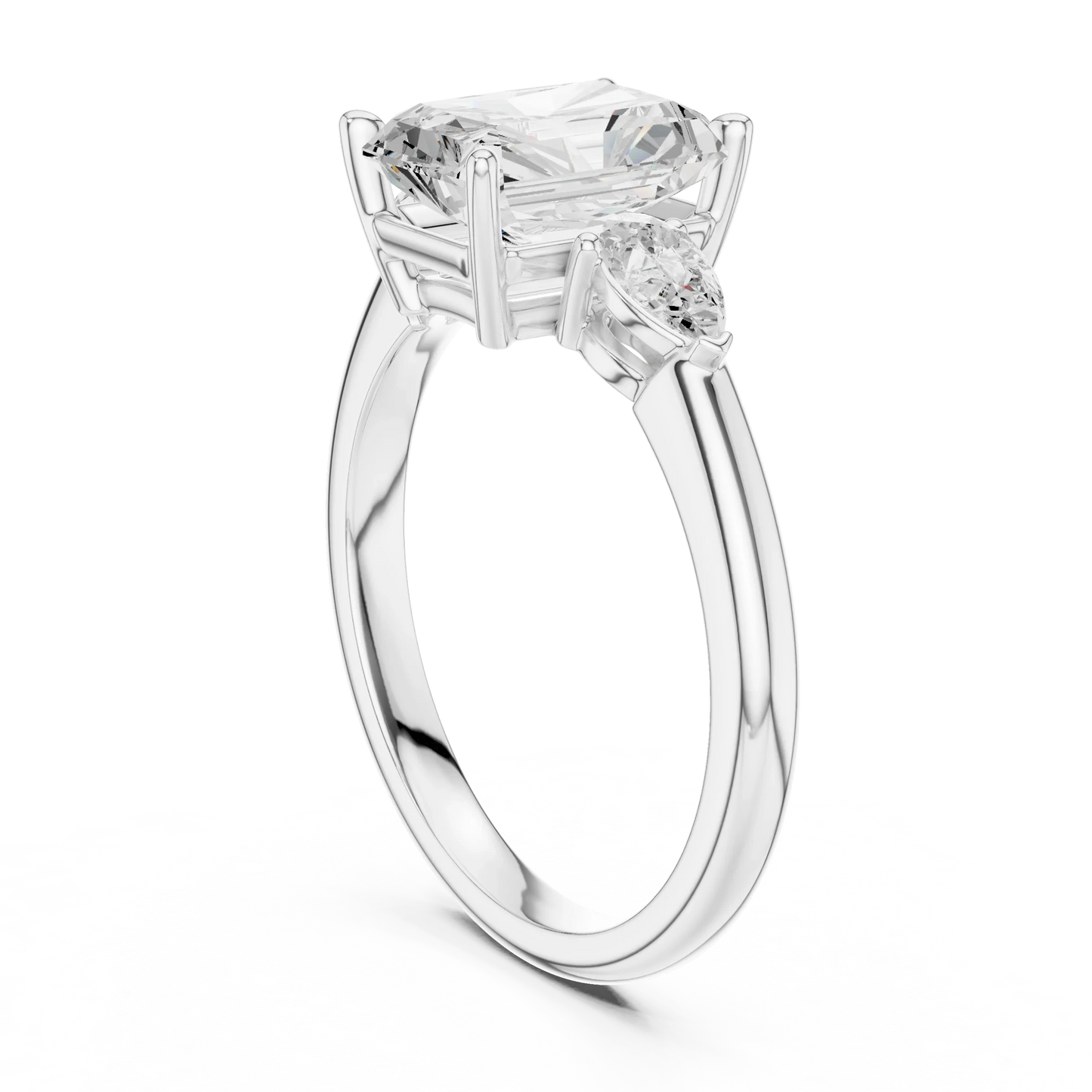 Back side view of white gold radiant three-stone ring with pear side stones and lab-grown diamond 鈥?Australia
