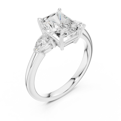 Front view of white gold radiant three-stone ring with pear side stones and lab-grown diamond 鈥?Australia