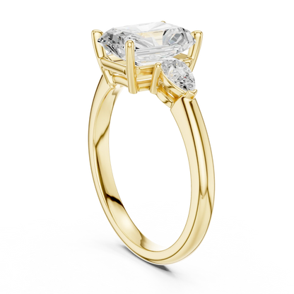Back side view of yellow gold radiant three-stone ring with pear side stones and lab-grown diamond 鈥?Australia