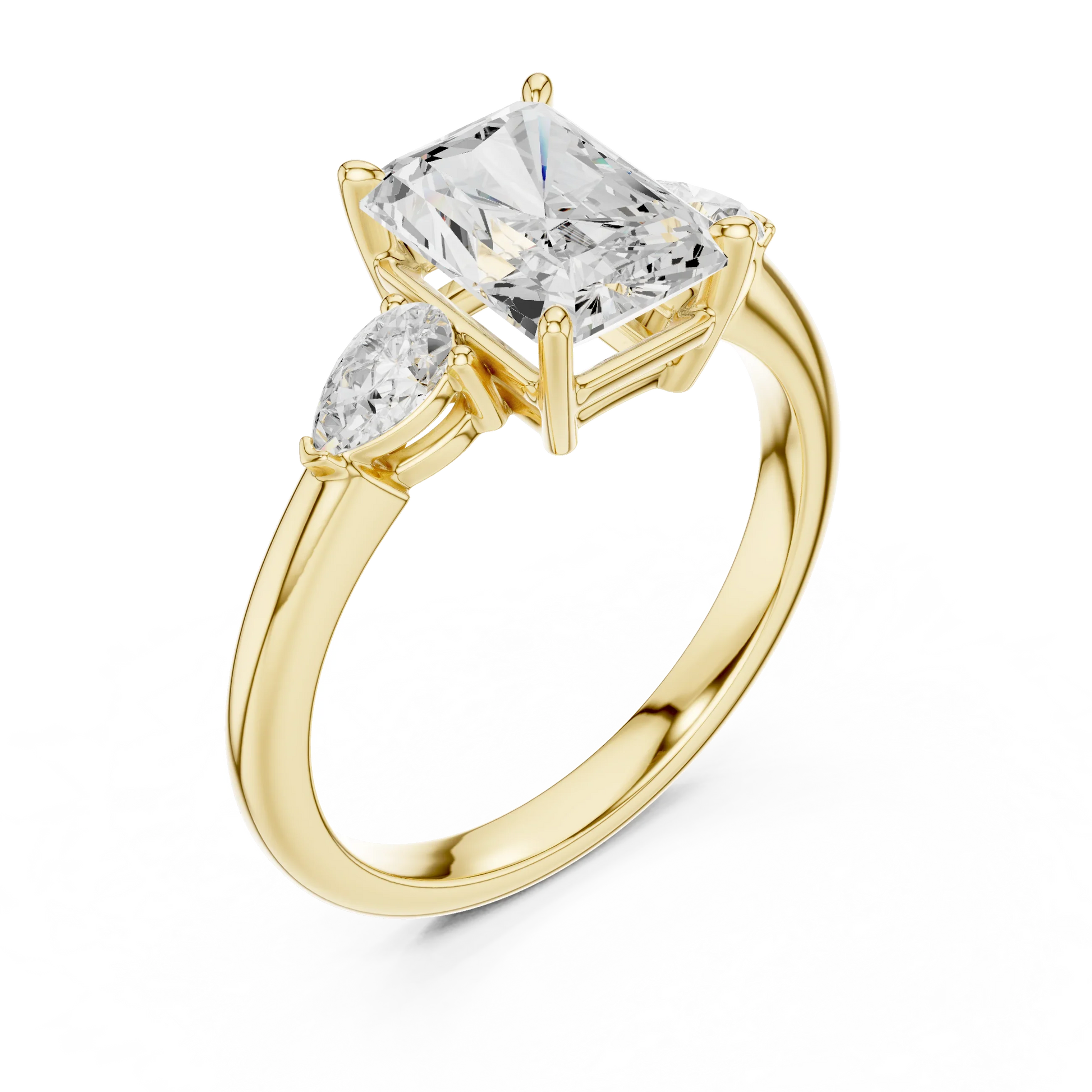 Front view of yellow gold radiant three-stone ring with pear side stones and lab-grown diamond 鈥?Australia
