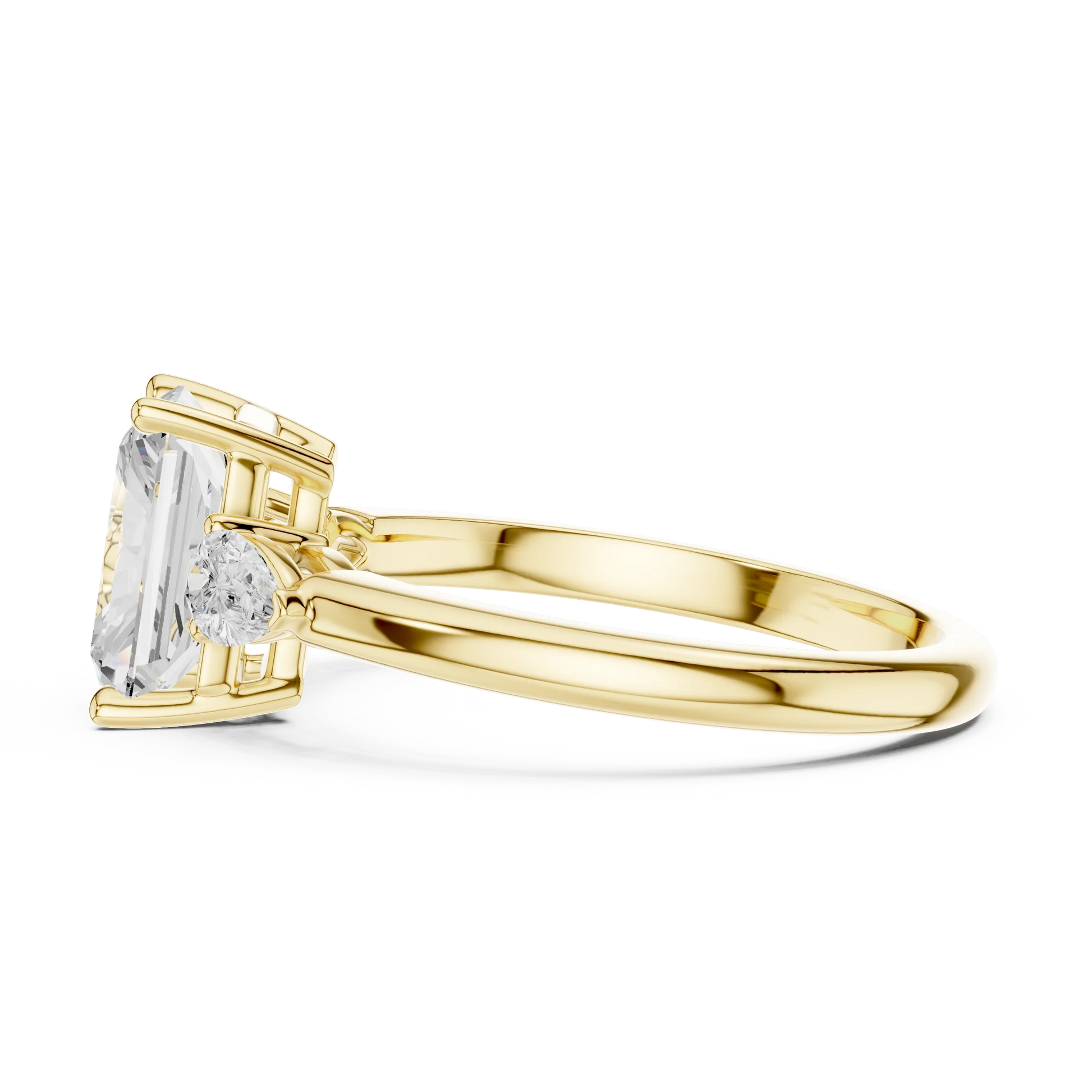 Side view of yellow gold radiant three-stone ring with pear side stones and lab-grown diamond 鈥?Australia