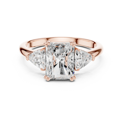 Radiant three-stone ring in rose gold with trillion cut side stones and lab-grown diamond 鈥?Australia