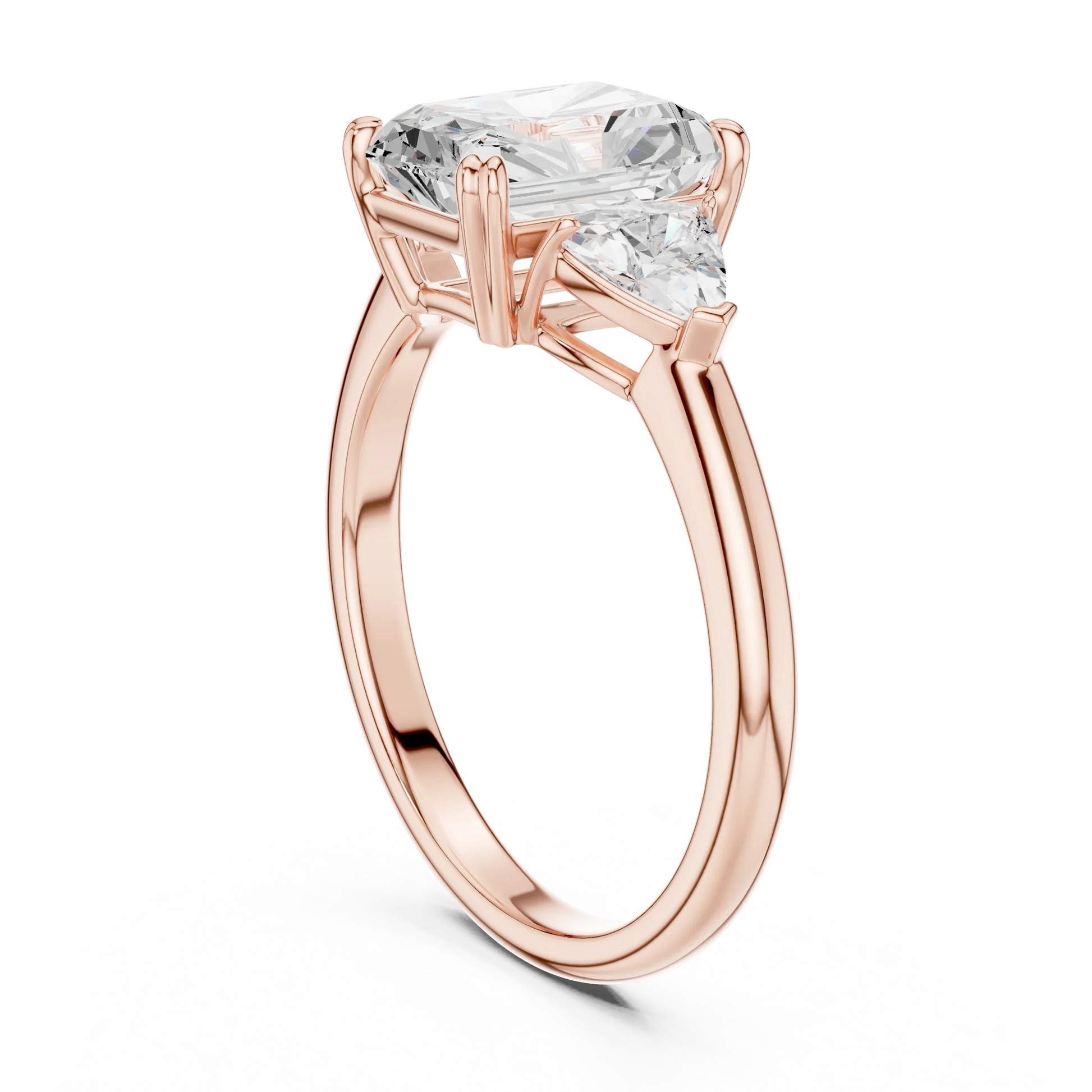 Back side view of rose gold radiant three-stone ring with trillion cut side stones and lab-grown diamond 鈥?Australia