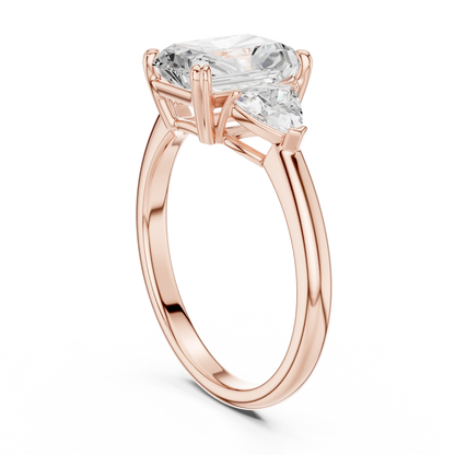 Back side view of rose gold radiant three-stone ring with trillion cut side stones and lab-grown diamond 鈥?Australia