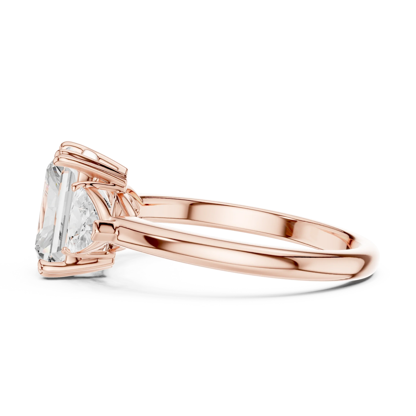 Side view of rose gold radiant three-stone ring with trillion cut side stones and lab-grown diamond 鈥?Australia