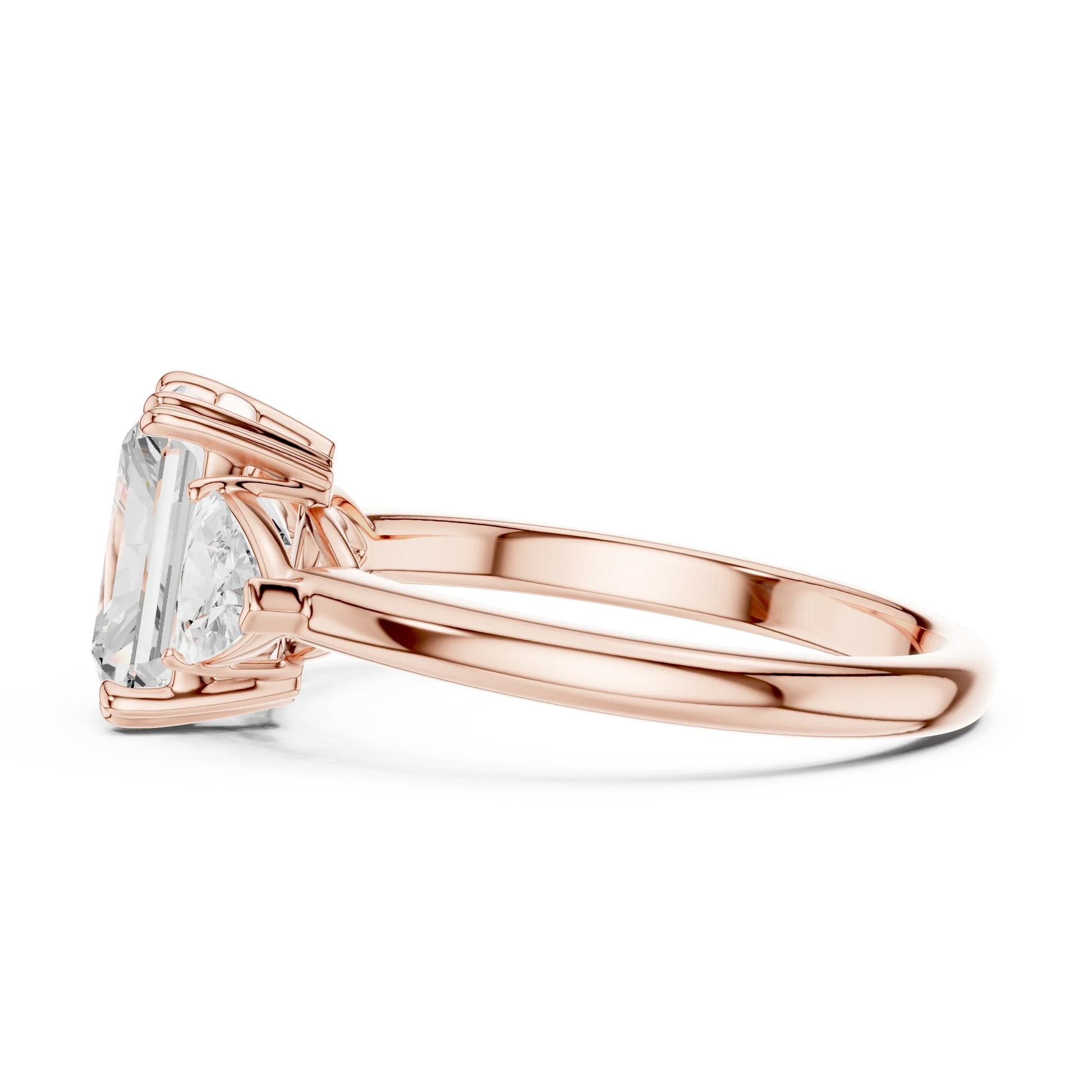 Side view of rose gold radiant three-stone ring with trillion cut side stones and lab-grown diamond 鈥?Australia