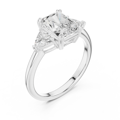 Front view of white gold radiant three-stone ring with trillion cut side stones and lab-grown diamond 鈥?Australia
