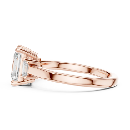 Radiant three stone engagement ring with emerald cut side stones in rose gold, lab grown diamond, side view, Australia DFE