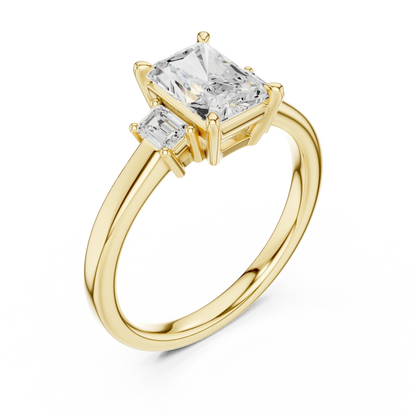 Radiant three stone engagement ring with emerald cut side stones in yellow gold, lab grown diamond, front view, Australia DFE
