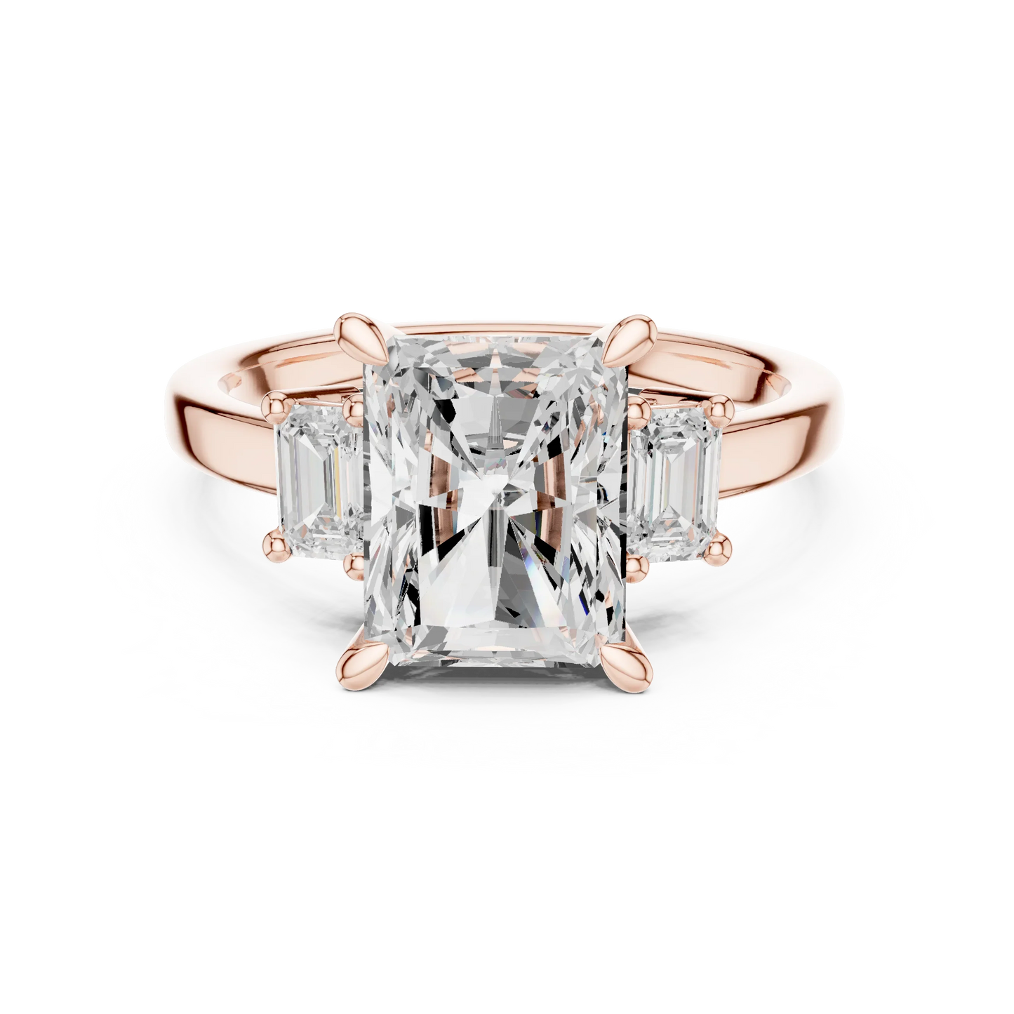 Radiant three stone ring with step cut trapezoid side stones and lab-grown diamonds in rose gold with modern romantic finish