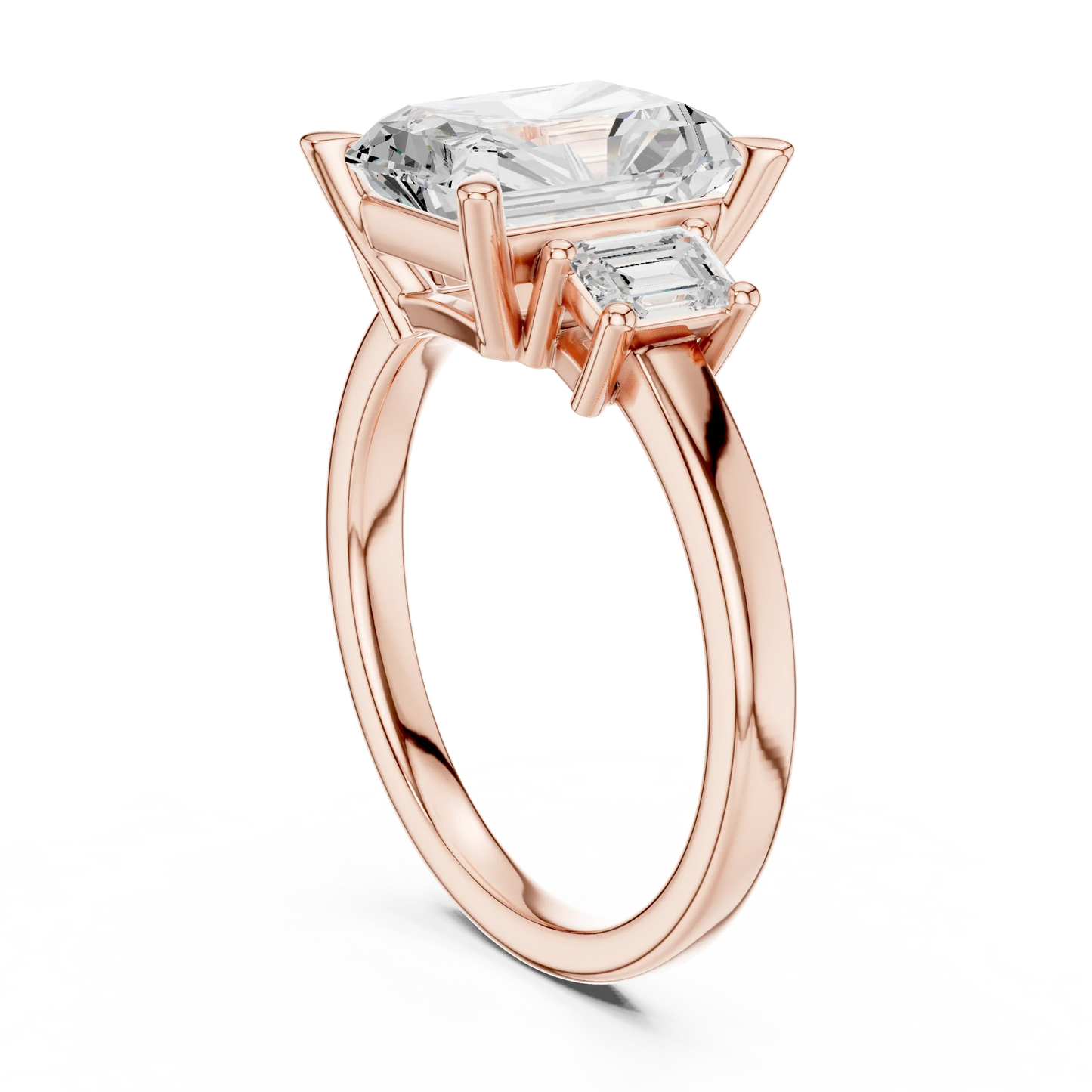 Back view of rose gold radiant three stone ring featuring step cut trapezoid side stones and polished band