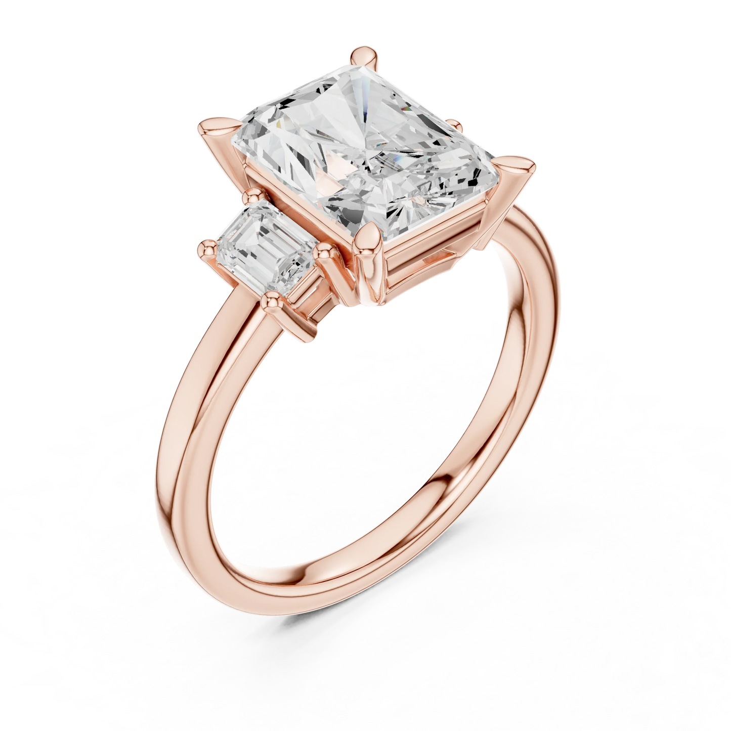 Front view of rose gold radiant three stone ring with step cut trapezoid side stones and lab-grown diamonds