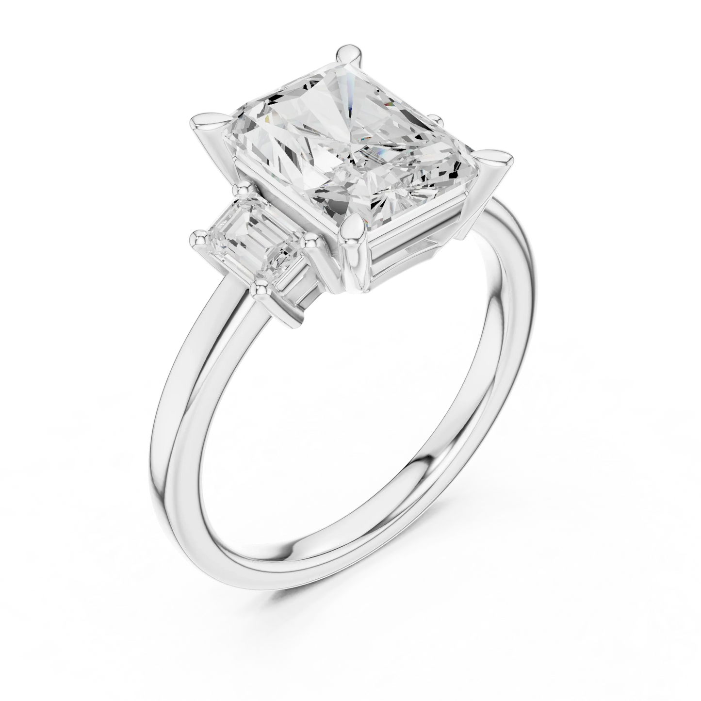 Front view of white gold radiant three stone ring with step cut trapezoid side stones and lab-grown diamonds