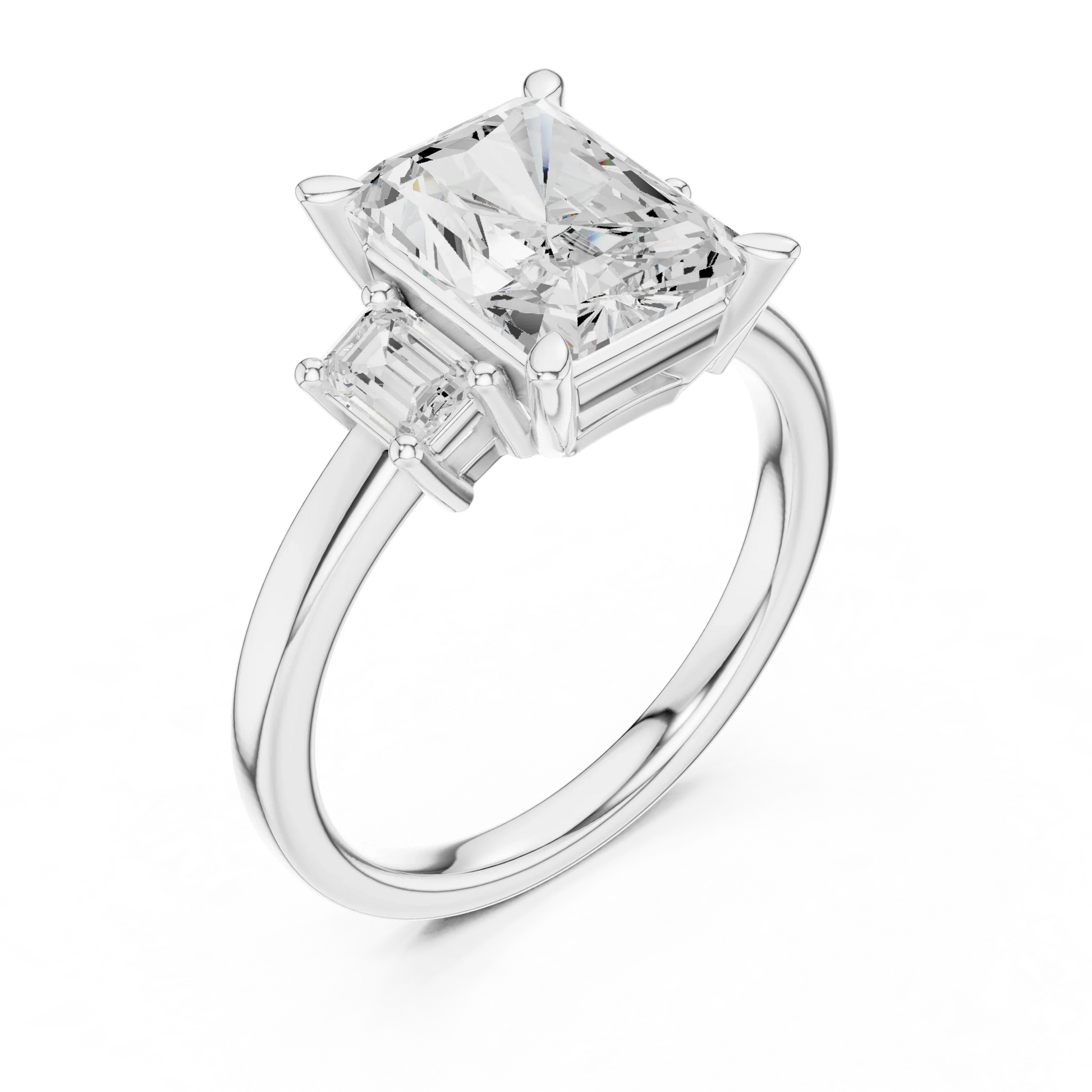 Front view of white gold radiant three stone ring with step cut trapezoid side stones and lab-grown diamonds