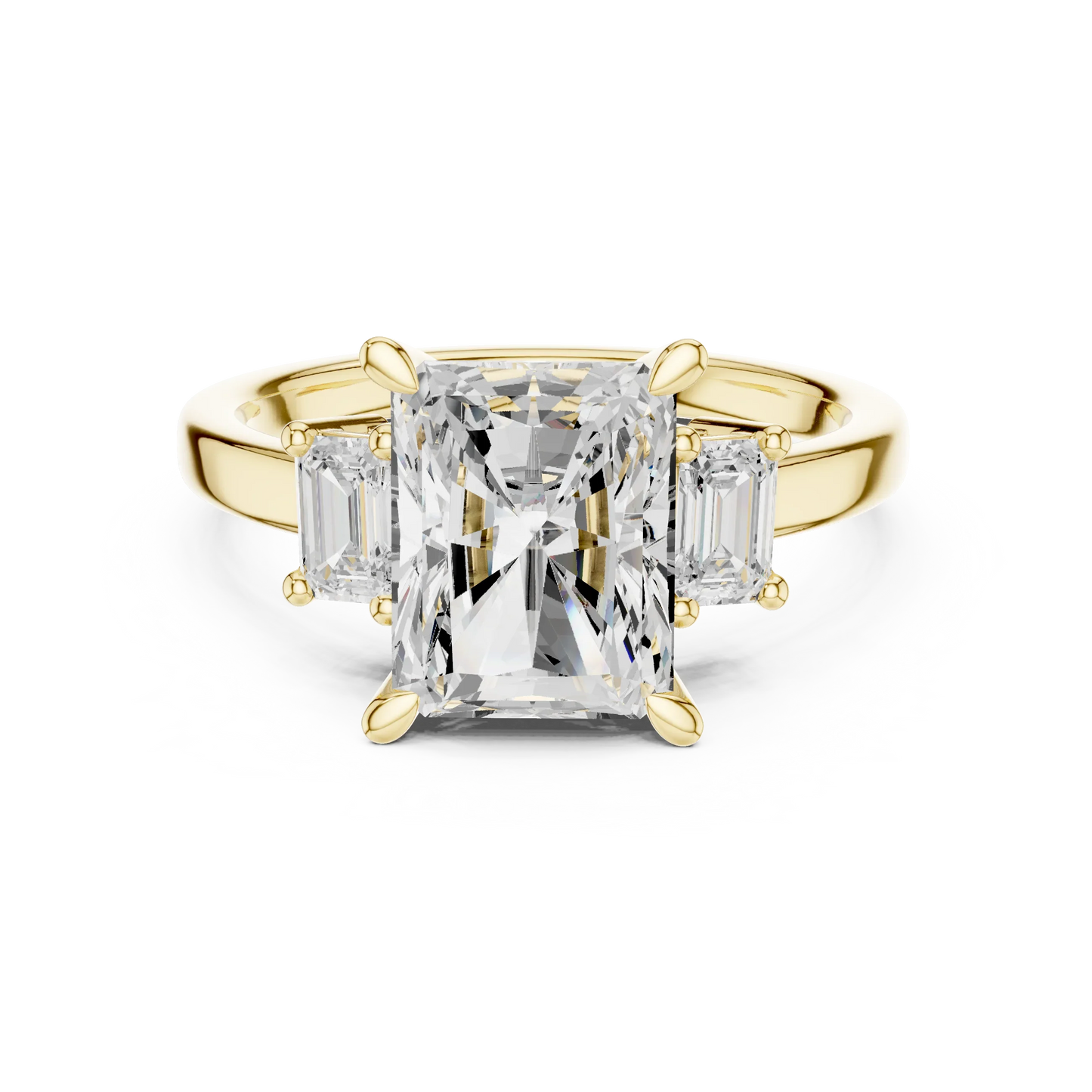 Radiant three stone ring with step cut trapezoid side stones and lab-grown diamonds in yellow gold with classic luxury appeal