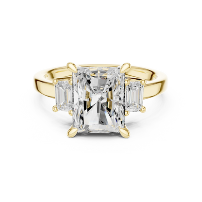 Radiant three stone ring with step cut trapezoid side stones and lab-grown diamonds in yellow gold with classic luxury appeal