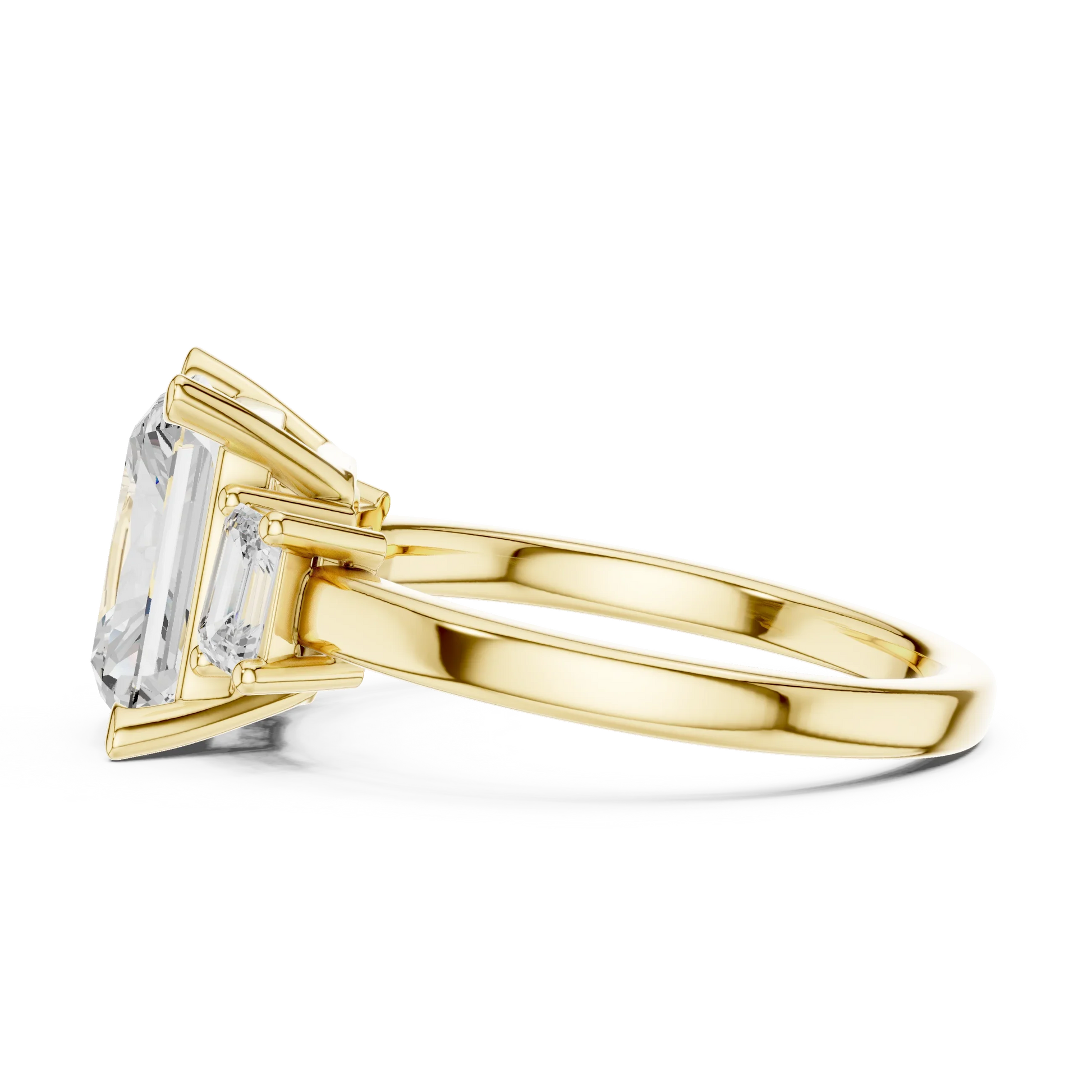 Side profile of yellow gold radiant three stone ring highlighting step cut trapezoid side stones and structure